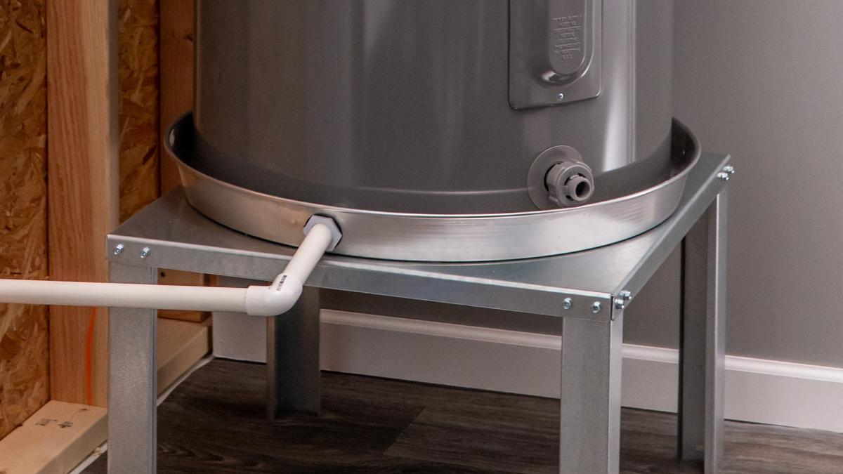 Water heater stand with pan.
