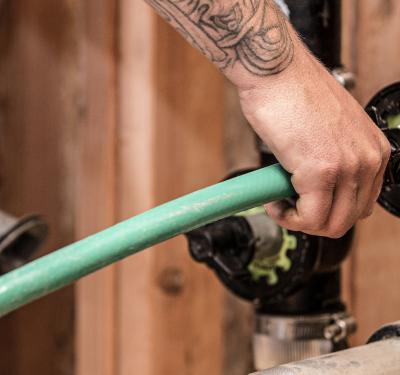 Plumber performing a DWV test with TestRite.