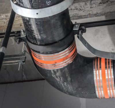 No-hub cast iron pipe restraint and support system for DWV applications