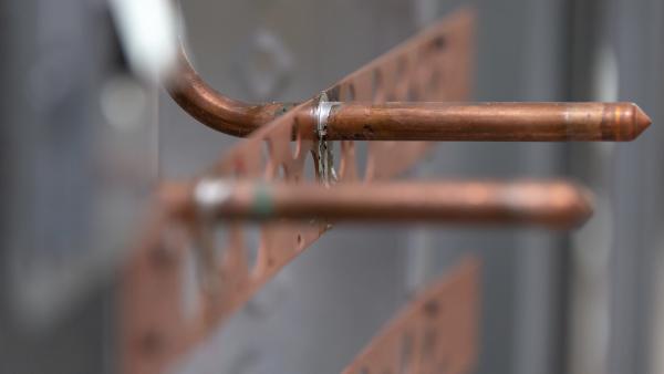 Copper-bonded pipe mounting brackets with soldered stub-out connections