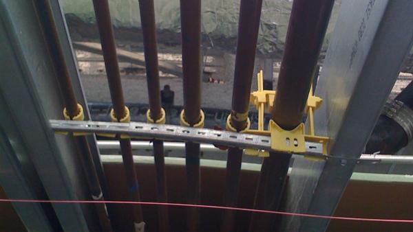Flame-rated plenum pipe support clamps and acoustic isolators