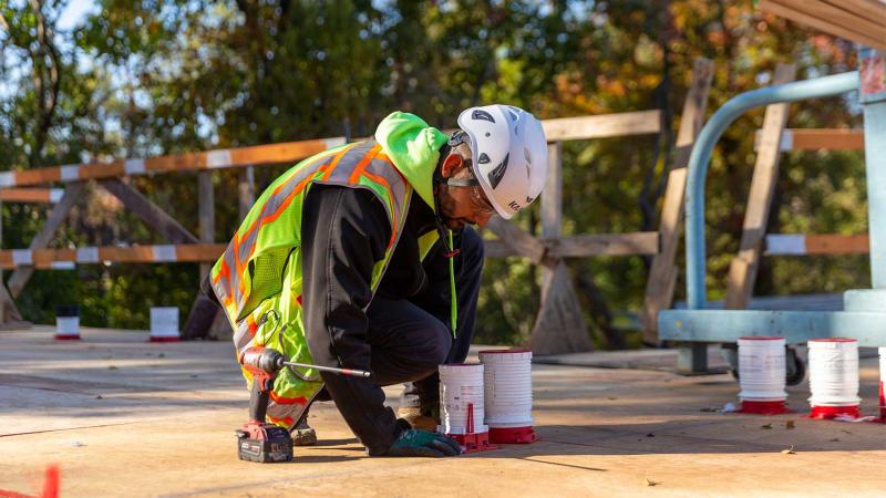 mechanical contractor installing firestop materials