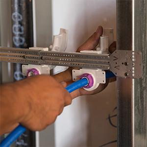 In-wall PEX pipe support designed to secure tubing inside wall cavities during rough-in