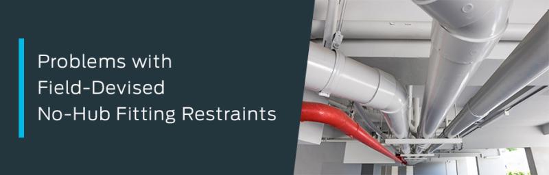 overhead plumbing installation showing no-hub pipe fittings and restraints