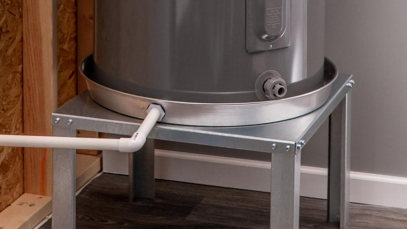 Water heater stand with pan.